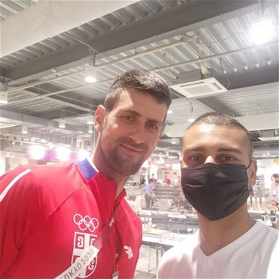 It's not very often that you get to stand next to a world class athlete... That's probably what Novak Djokovic was thinking when he graciously took this pic with me