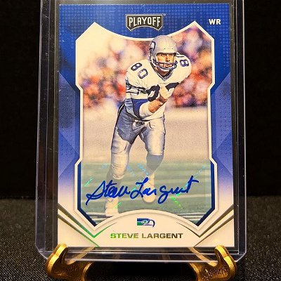 Steve Largent retired, holding all major NFL receiving records, including: 

most receptions in a career (819) 

most receiving yards in a career (13,089)

and most touchdown receptions (100)

He was also in possession of a then-record streak of 177 consecutive regular-season games with a reception.

His 1985 franchise receiving yard record (1,287) with The Seahawks stood until the year 2020 when broken by DK Metcalf.

Largent was inducted into the Pro Football Hall of Fame in 1995, his first year of eligibility.
*
*
*
*
@paniniamerica @seahawks @profootballhof 

#sportscards#sportscardsforsale#sportscardscollector#sportscardscollection#sportscardsinvestments#sportscardcommunity#sportscardinvestor#sportscards4sale#tradingcard#tradingcards#tradingcardsforsale#footballcards#footballcardsforsale#paniniamerica#paninifootball#autocard#autocards#quarterbacks#paniniplayoff#stevelargent#footballautographs#seattleseahawks#seahawks#seahawksnation#seahawksfan#seahawksfootball#seahawksfans