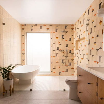 Designer Kaitlyn Wolfe had to find a balanced compromise for this couple’s primary bathroom. “He is Swedish and loves a Scandinavian midcentury modern look, while she likes things a little more eclectic,” Wolfe says. The new design balances clean lines for him with colorful and dynamic geometric tiles...