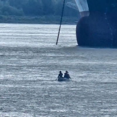 The advantage of being one of the rare paddlers through a very busy area is sometimes you come across pictures of yourself someone took from a distance. This really captures the scale of the big oil tankers vs our little canoe.