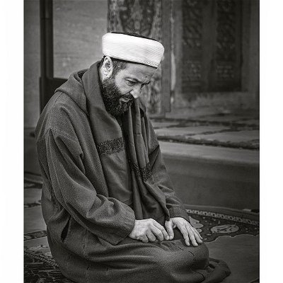 .
Istanbul, Turkey | 2019
- Valide Atik Mosque -
‘Shaykh Mokhtar Maghraoui’

I captured this portrait of Shaykh Mokhtar the day he and Shaykh Muhammad Haydara Al Jilani met for the first time. It was an amazing sight to behold. Each of them praising the other with each rejecting the others praise. 

Shaykh Mokhtar was teaching his weekly class in the Valide Atik Mosque. When Shaykh Muhammad arrived, Shaykh Mokhtar stopped his class and he and all the students stood up to welcome Shaykh Muhammad who had traveled to Istanbul from The Gambia. 

After a warm embrace they sat down and lovingly fought over who would sit in the teacher’s chair. After some back and forth, Shaykh Mokhtar sat on the ground in front of Shaykh Muhammad and insisted that Shaykh Muhammad continue teaching in his place. 

Shaykh Muhamamd reluctantly obliged and said he was only doing so because he didn’t want to deny the request of Shaykh Mokhtar.  Shaykh Mokhtar kneeled on the floor in front of Shaykh Muhammad and it was this moment that captured this portrait. 

It was a lesson in humility from both men that I will never forget InshAllah. 

The Prophet Muhammad ﷺ is reported to have said, “Indeed, the most beloved of you to me and the nearest of you to my position on the Day of Judgement are the best of you in nature and in humility; and the furthest of you from me are the vainglorious, that is the arrogant.”

.
.
.
.
.
#masjid #camii #mosquesofworld #mosques #halaltravel #islamicarchitecture #lovetheprophet #masjidharam #humilty #humbleness #shaykh #almadina #mosquephotography #awliya #awliyaallah #shaykhmokhtarmaghraoui #thegambia #istanbul🇹🇷 #hadithoftheday #muslimteachers #islamicknowledge #islamicknowleged