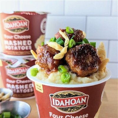 I've partnered with @idahoanfoods to create my own Mash-A-Bowl recipe using Idahoan’s Four Cheese Mashed Potato Cups! 

Last week, I visited Idahoan’s #MashedInAmericaTour – the world’s 1st immersive mashed potato experience – at the Big 12 Championship and had so much fun! 

I was inspired by Kansas City Barbecue to create my BBQ Pork Meatball Mash-A-Bowl, topping Idahoan’s Four Cheese Mashed Potato Cup (made from 100% real Idaho potatoes!) with delicious barbecue pork meatballs, French fried onions and chives! 

Find the entire recipe below.

For even more delicious Idahoan Mash-a-Bowl recipes, visit https://idahoan.com/recipes/

Michelle’s BBQ Pork Meatball Mash-A-Bowl

Serves 2

Ingredients:

2 Idahoan Four Cheese Mashed Potato Cups
1/2 pound ground pork
1/4 cup Italian breadcrumbs
1/8 cup grated parmesan cheese
1 teaspoon Dijon mustard
1 teaspoon brown sugar
1/2 teaspoon onion powder
1/4 teaspoon salt
1/8 teaspoon black pepper 
3/4 cup Kansas City-style barbecue sauce 
For garnish (optional): French fried onions, diced green onions

Instructions:
Prepare the Idahoan Mashed Potato Cups following package instructions.
Prepare the meatballs: In a large bowl, add pork, breadcrumbs, cheese, mustard, brown sugar and spices. 
Combine well, then form into meatballs no larger than 1-inch on any side. 
Add 2 teaspoons olive oil to a non-stick skillet, and heat on medium-high heat.
Add the meatballs, and sear for 3-4 minutes per side. Once seared to golden brown on two sides, roll the meatballs on their edges to sear the remaining surface area until they reach an internal temperature of 145 degrees Fahrenheit using an instant read thermometer.
Remove the cooked meatballs to a medium bowl or casserole dish and top with 3/4 cup barbecue sauce of your choice. Toss gently to coat the meatballs with the sauce.
Top the Idahoan Four Cheese Mashed Potato Cups with the sauced meatballs and optional garnish. Enjoy!